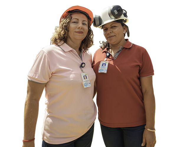 Two women in front of a water plant